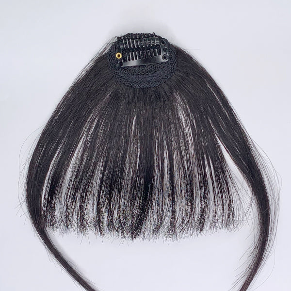 Luvme 100% human hair clip-in bangs extension showing natural hair texture and seamless clip-in attachment on a model.