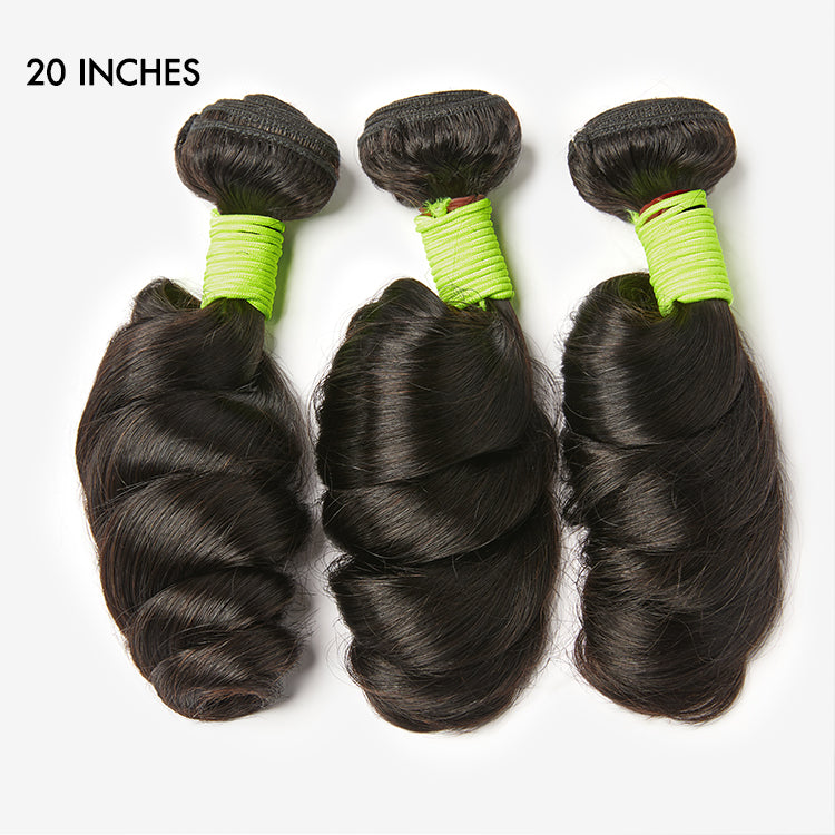 Three loose wave virgin human hair bundles from Luvme, showcasing soft, shiny natural wave texture and full, thick bundles.