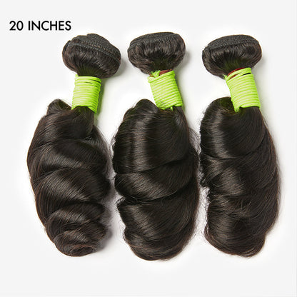 Three loose wave virgin human hair bundles from Luvme, showcasing soft, shiny natural wave texture and full, thick bundles.