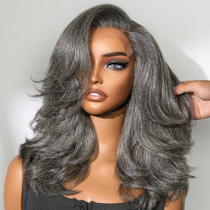 Gray layered blowout wig with shoulder-length wavy style, glueless design, HD lace, from Luvme Hair.