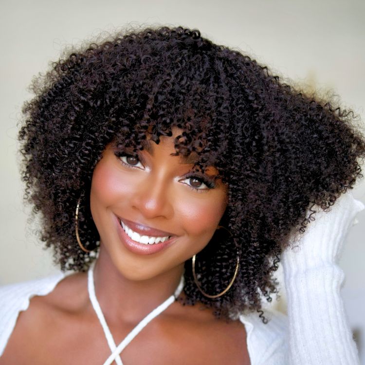 Luvme Hair breathable minimalist lace curly wig with bangs, bouncy Jerry curls, and a glueless design for a natural look.