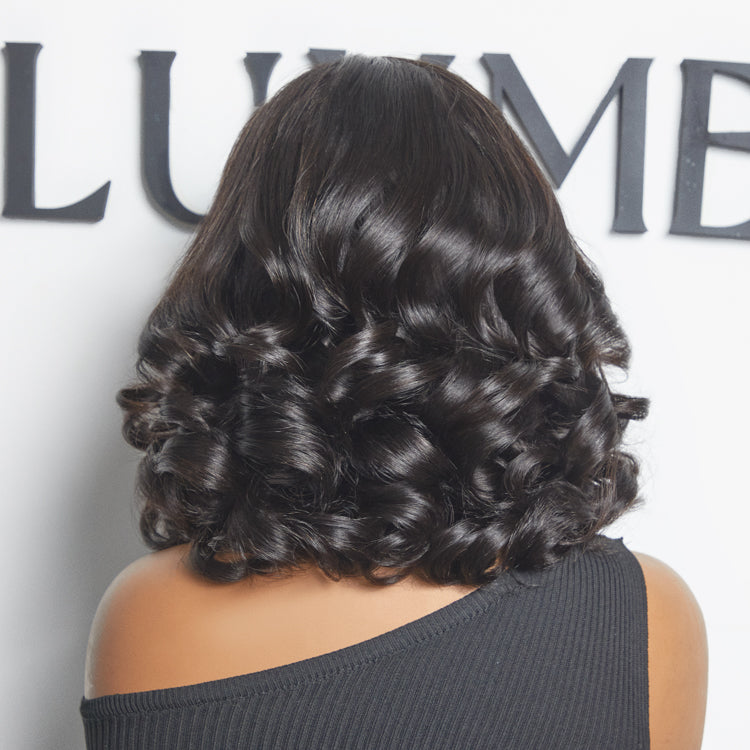Luvme All-Day Comfort™ voluminous loose body wave glueless HD lace wig with pre-cut lace, 200% density, minimalistic style.