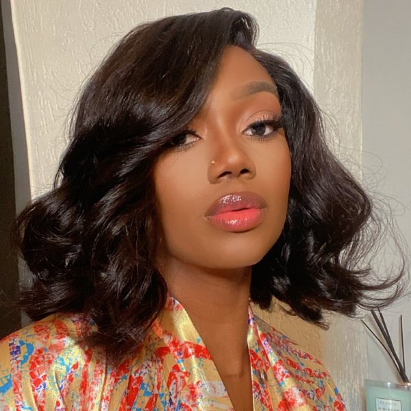 Luvme natural black wavy minimalist HD lace glueless C-part short wig made from 100% human hair, showcasing its sleek style.
