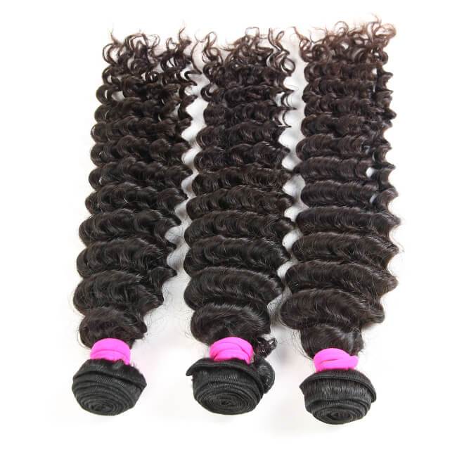 Three deep wave 100% virgin human hair bundles from Luvme, showcasing their curly texture and natural shine.